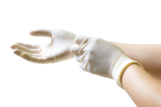 Doctor Putting On Sterile Gloves Isolated On White Background