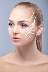 Spa portrait of attractive woman with arrows on face Face lifting concept. Plastic surgery treatment, medicine