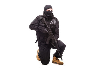 terrorist with machine gun isolated on white background