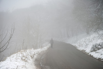 Beautiful Winter landscape image around Mam Tor countryside in Peak District England with thick fog...