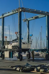 Fotobehang boat  lift out of the water © kuznets5smit7