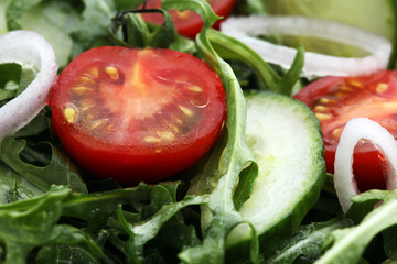 Bowl of salad on wooden table