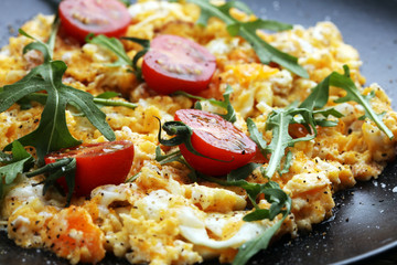 Traditional breakfast - fried eggs,ruccola, tommato- - diet concept scrambled eggs