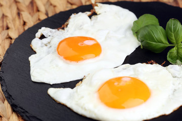 fried eggs with basil pepper and salt