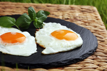 fried eggs with basil pepper and salt