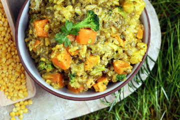 Lentil curry with carrot, cauliflower, broccoli and onion in a bowl. Healthy lifestyle. Diet menu
