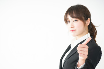 Young business woman showing OK gesture