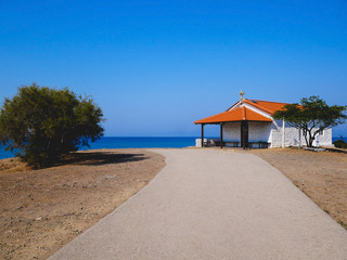 Traditional small white church with sea view in Cassandra peninsula,Greece.
