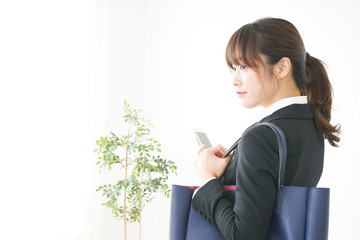 Young business woman walking on the street