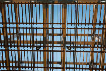 Wooden Roof Structure with Lamps and Cams