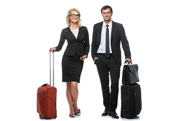 Businessman and business woman with travel cases