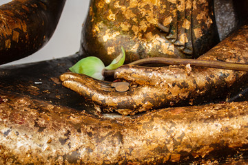 Gold sheet stick on hand buddha statue.