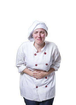 Young woman chef has stomach pain. she is suffer