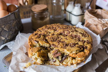 A large pile of homemade chocolate chip cookies