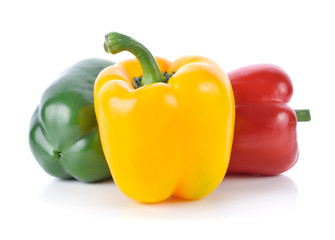 colored peppers over white background