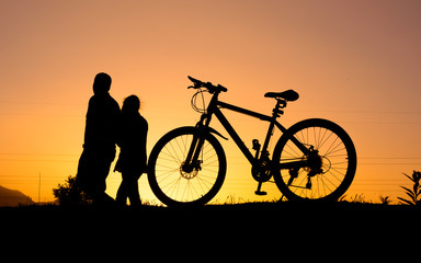 Plakat silhouette of parked bicycle on warm tone with some copy space