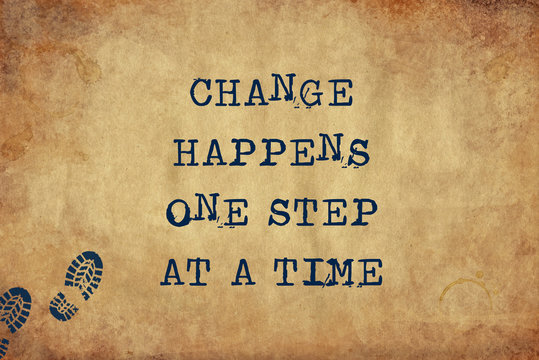 Inspiring motivation quote of change happens one step at a time with typewriter text. Distressed Old Paper with Typing image.