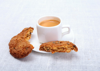 Fresh homemade muffin, cake and white cup of Cappuccino on white background.