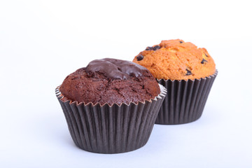 Fresh homemade muffins on white background. Top view.