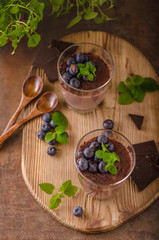 Chocolate pudding with berries and herbs