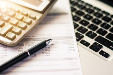 Bill and calculator with pen, paper bill charge.