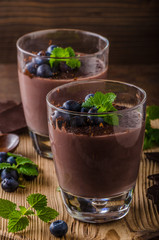 Chocolate pudding with berries and herbs