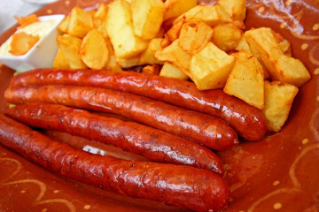     Serbian sausage and potatoes in a dish 
