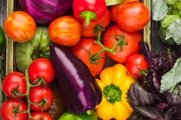 Set of raw vegetables in the wooden tray