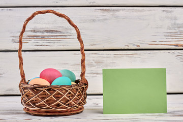 Easter egg basket, blank card. Empty green paper.