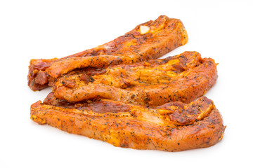 Spicy marinated spare ribs barbecued on the white background.