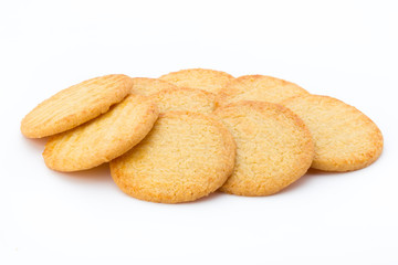 Stacked short pastry cookies isolated on white background.