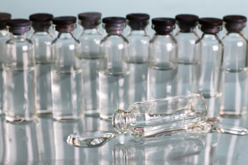 transparent vials of medicine