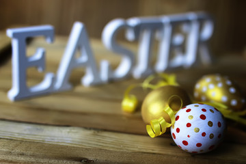 Easter flower and eggs on wooden