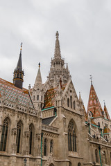 Fototapeta na wymiar Matthias Church in Buda castle on a cloudy day in Hungary capital Budapest