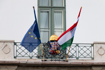 National hungarian and Europe Union flags on presidential palace entrance in Budapest, Hungary