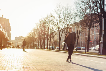 Beautiful attractive young girl in the evening in the city
