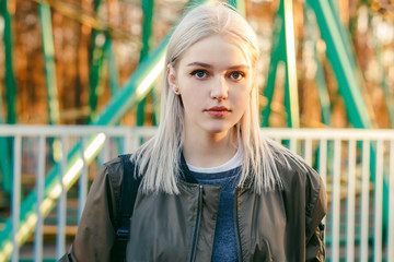 Fototapeta premium Beautiful attractive young girl in the evening in the city