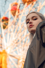 Beautiful attractive young girl in the evening in the city