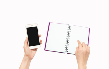 hand holding mobile phone and note book