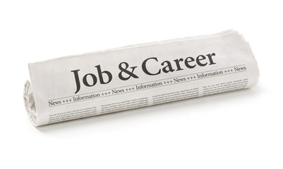 Rolled newspaper with the headline Job and Career