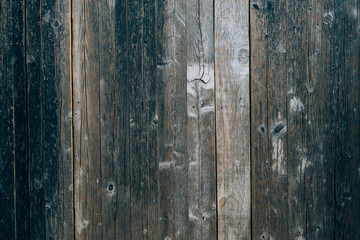 Old black doors. Wood texture. Texture of metal. Old shabby, irradiated paint