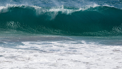 Big breaking wave at Hanakapiai beach, Kauai, Hawaii.