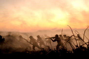 War Concept. Military silhouettes and tanks fighting scene on war fog sky background, World War...