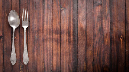 Old cutlery. On Wooden background. Top view.