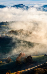 mountain rural area in foggy autumn morning