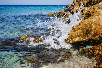 Blue sea and sharp rocks that surround it