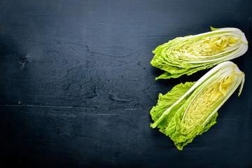 fresh chinese cabbage on wooden table. Top view. - obrazy, fototapety, plakaty