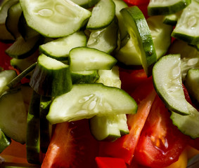 Sliced cucumbers and tomatoes in a bowl