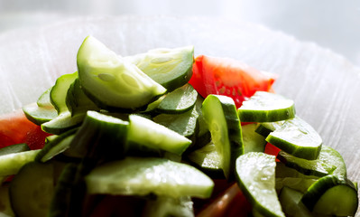 Sliced cucumbers and tomatoes in a bowl