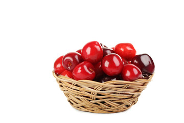 Ripe cherries in basket isolated on a white background